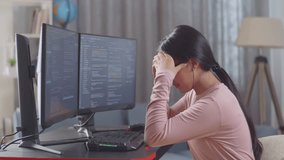 Asian Teen Girl Programmer Having A Headache Creating Software Engineer Developing App, Program, Video Game On Desktop Computer At Home. Terminal With Coding Language 
 - Powered by Shutterstock - Get 15% off with code: PIKWIZARD15
