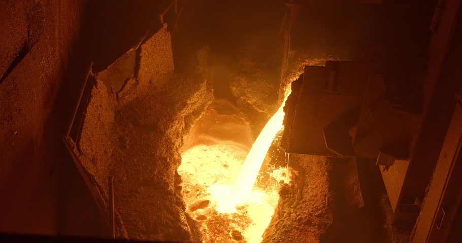 Metal casting process in metallurgical plant. Liquid metal pouring into molds | Shutterstock HD Video #1100544077