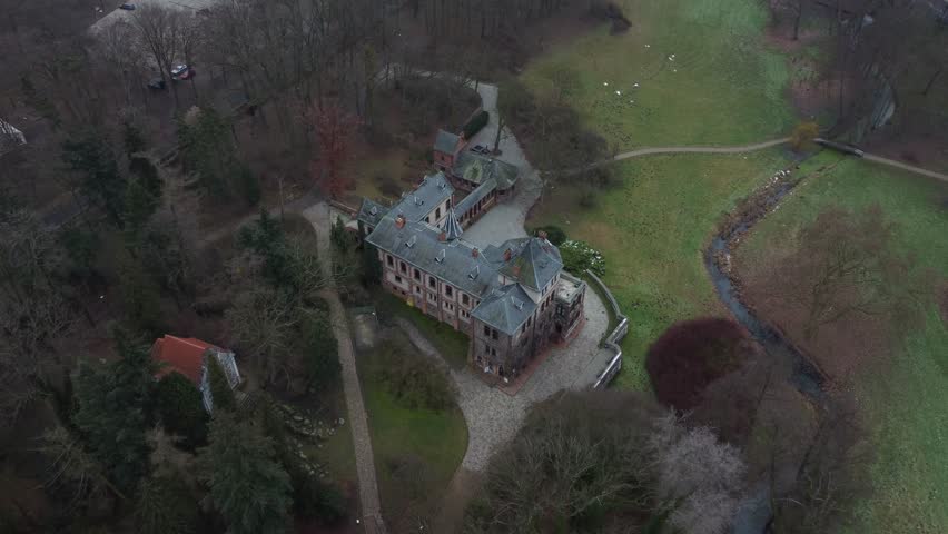 Discovering hidden gems from above. This beautiful castle in the park is a sight to behold in 4K drone video. | Shutterstock HD Video #1100545047