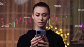 A girl trader checks her income at home using her smartphone. Infographic animation. Augmented reality hologram of the growth of NFT cryptocurrency sales. - Powered by Shutterstock - Get 15% off with code: PIKWIZARD15