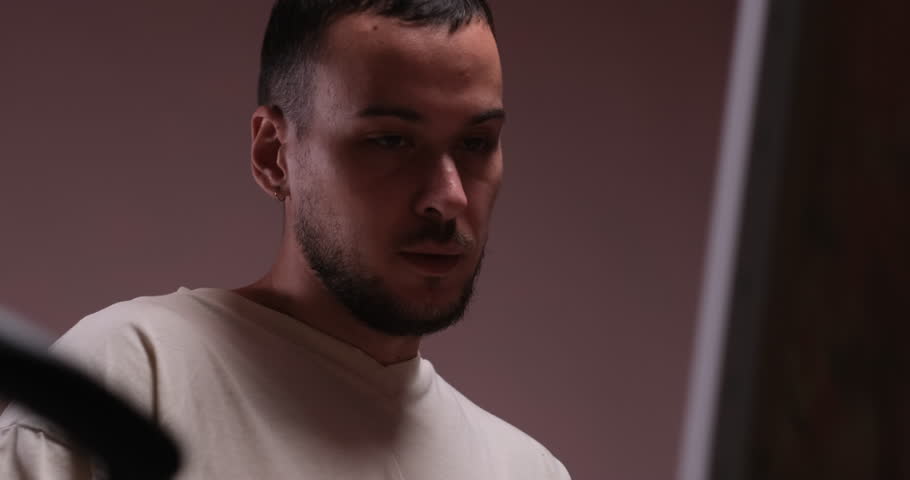 Middle portrait of enthusiastic male artist