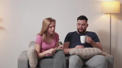 Premium Photo  Boyfriend sits engrossed in playing online games on his  smartphone, ignoring his girlfriend waiting.