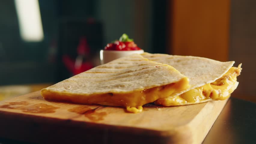 Close up of cheese quesadilla, Eating Traditional Mexican food, tex mex cuisine. Hands taking cooked quesadilla with vegan pork beef meat and vegetables,  Royalty-Free Stock Footage #1100558415