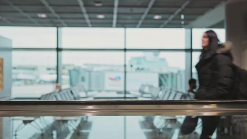 People at the white airport lounge from the moving perspective | Shutterstock HD Video #1100558753