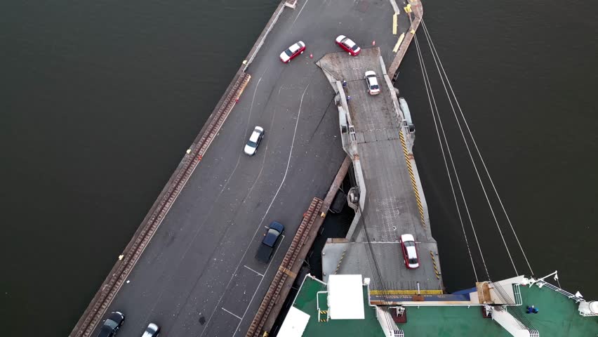 Aerial View of a Vehicle Car Carrier Ship Unloading Cars in Port 