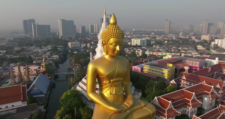 An aerial view of the Giant Buddha and Pagoda at Wat Paknam Phasi Charoen Temple, The most famous tourist attraction in Bangkok, Thailand Royalty-Free Stock Footage #1100569795
