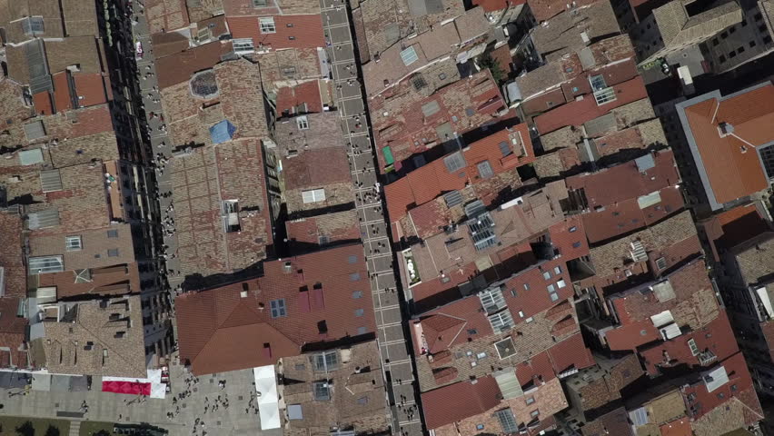 Aerial looks down to tourist crowds on streets of Pamplona, Spain