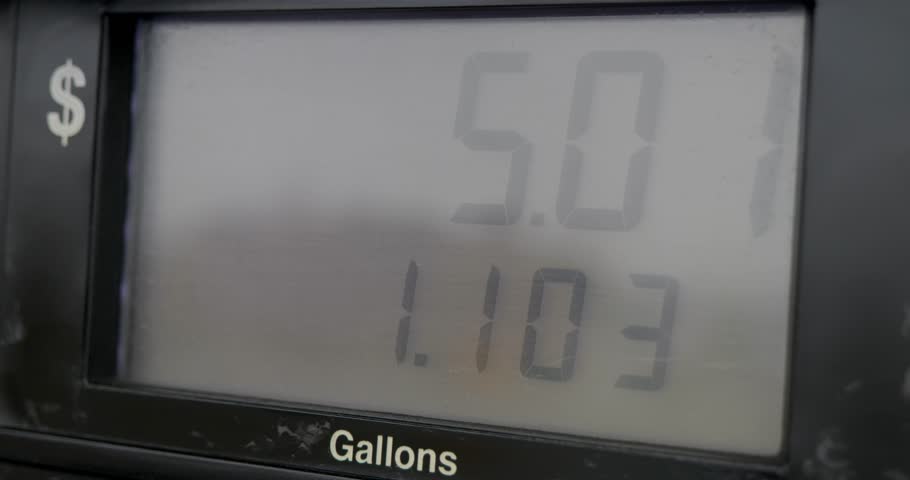 Gas station pump screen filling up and pumping slowly from over a gallon to 8 dollars worth of fuel. | Shutterstock HD Video #1100572363