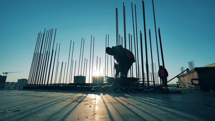 Industrial worker is demolishing concrete on the construction site Royalty-Free Stock Footage #1100576363