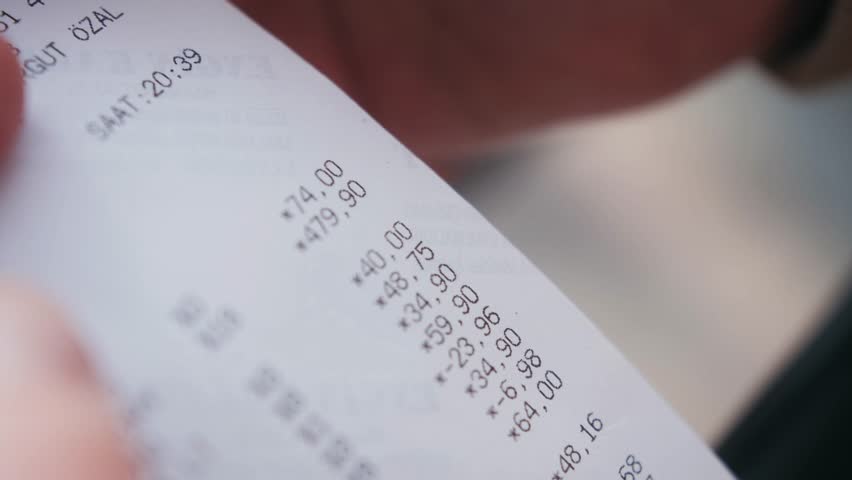 Customer checks Paper receipt on Supermarket after shopping. Royalty-Free Stock Footage #1100582455