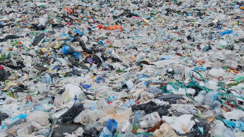 Garbage brought by the ocean is a garbage platform. The concept of environmental pollution | Shutterstock HD Video #1100582653