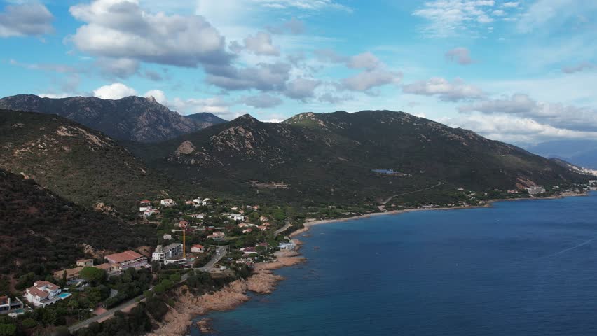 Aerial drone perspective of the landscape, mountains and sea at Corsica France  Royalty-Free Stock Footage #1100586359