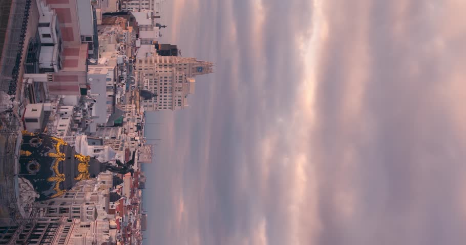 Madrid Gran Via Skyline during cloudy sunset timelapse day to night vertical smartphone ready Royalty-Free Stock Footage #1100586711
