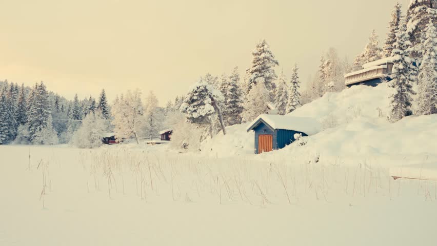 Countryside Landscape With Cottages And Frozen Foreground During Winter. Sideways Shot
