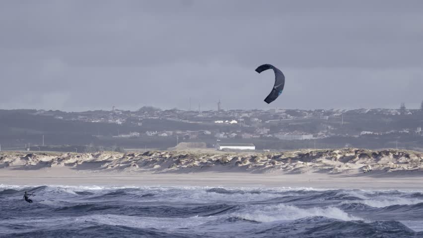 Kiteboarding or kitesurfing on rough ocean waves in Peniche, Portugal, one person view Royalty-Free Stock Footage #1100586923