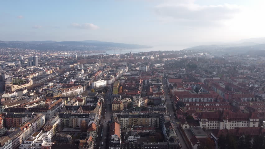 Aerial establishing shot over historic Zürich city in the heart of Switzerland