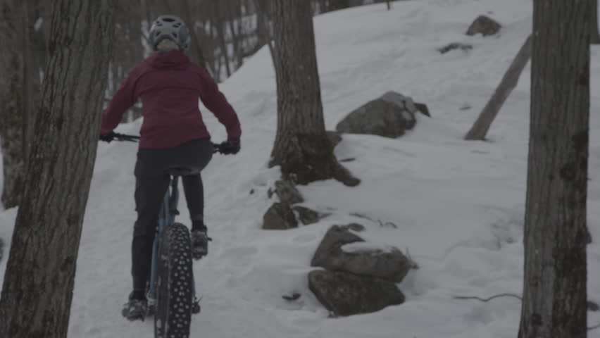 Mountain Biking - Fatbike pedalling up challenging hill side Royalty-Free Stock Footage #1100587761