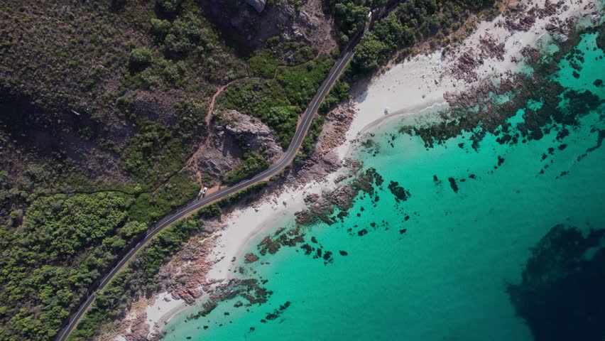 Aerial flying down towards the road and coastline in Eagle bay, dunsborough, Western Australia