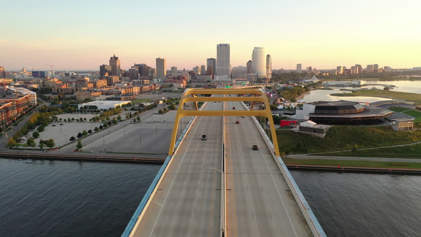 Aerial view of Hoan Memorial Bridge, highway in Milwaukee, Wisconsin, USA. Highway, traffic in morning at sunrise, Downtown in the background. Cityscape, Skyline
