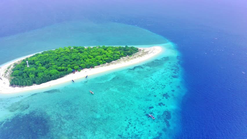 Pulau Tabuhan or Tabuhan Island located at Bali Straits, Banyuwangi. Indonesia. Aerial Footage taken with drone.