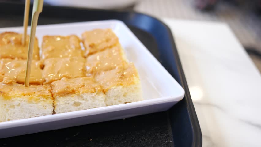 peanut butter spread on a bread 