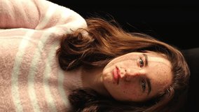 Portrait of a young woman, redhead, freckles, sun. Vertical video. - Powered by Shutterstock - Get 15% off with code: PIKWIZARD15