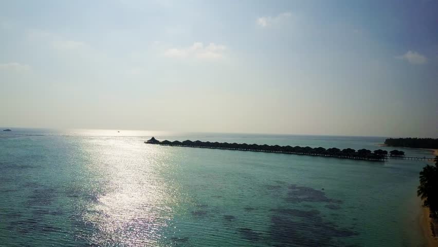 Maldives drone aerial view over the ocean and water bungalows