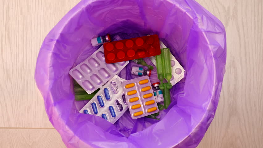 throws medicine pills into the trash. Royalty-Free Stock Footage #1100615229