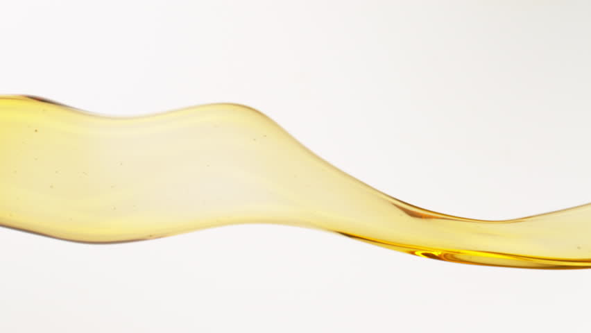 Super Slow Motion Shot of Flowing Oil on White Background at 1000fps. Royalty-Free Stock Footage #1100615631