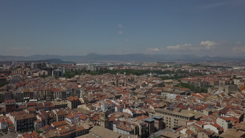 Rising aerial overlooks sunny Pamplona Spain, running with the bulls