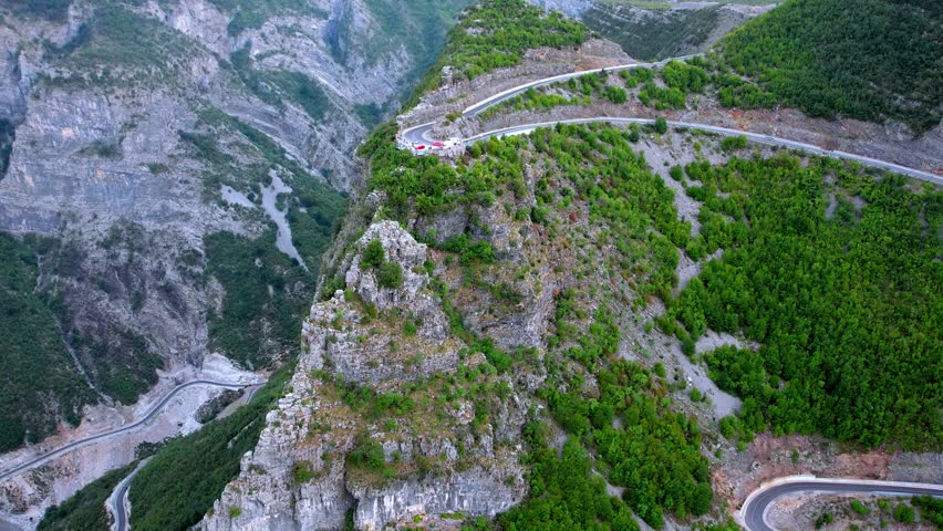 Aerial of scenic highway in Albania with hairpin bends from Shkoder to Vermosh