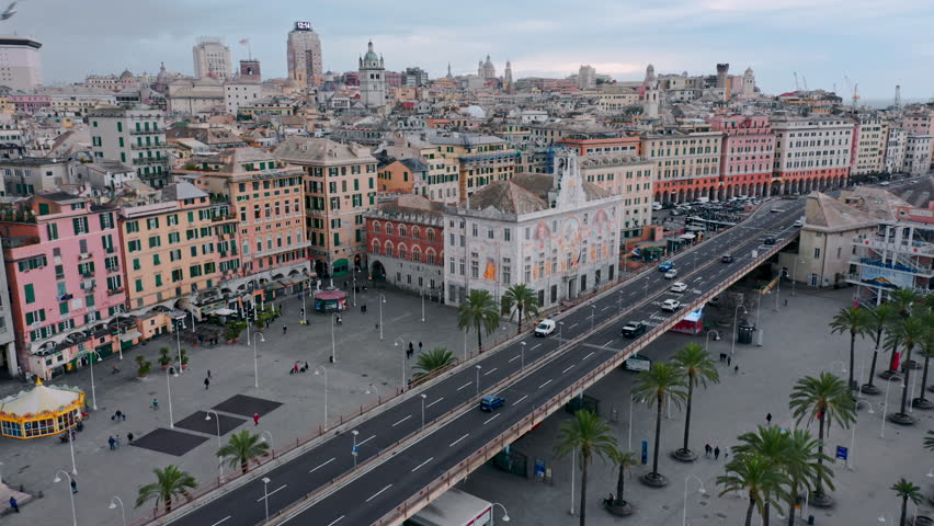 Historic Palazzo San Giorgio decorated with frescoes and Genoa city view; aerial