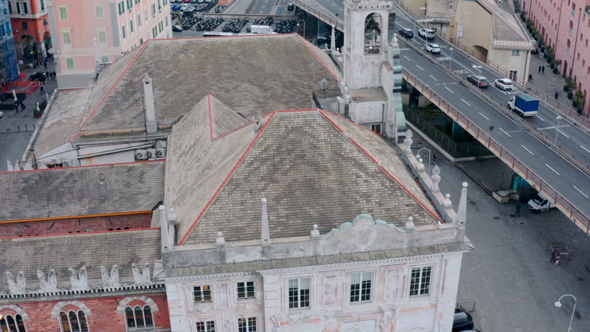 Iconic Palazzo San Giorgio in Porto Antico, Genoa, Italy; tight aerial arc