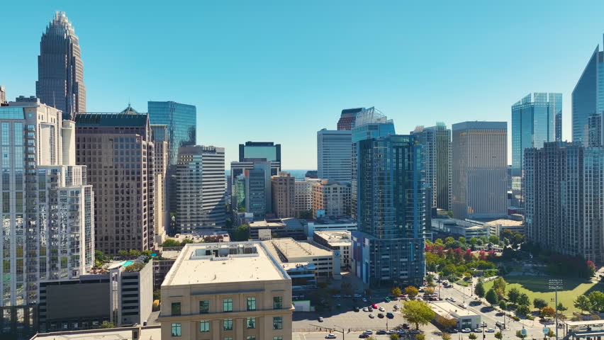 Urban landscape of downtown district of Charlotte city in North Carolina, USA. Skyline with high skyscraper buildings in modern american megapolis