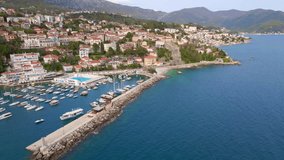 Aerial video. A harbor in the center of the city of Herceg Novi, a coastal city at the entrance to the Boka Kotor Bay. Travel destinations of Montenegro