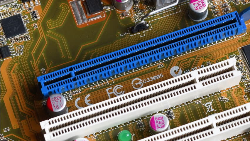detail of the PCI (Peripheral Component Interconnect) and PCI Express (Peripheral Component Interconnect Express) slots on a modern PC motherboard. Royalty-Free Stock Footage #1100622361