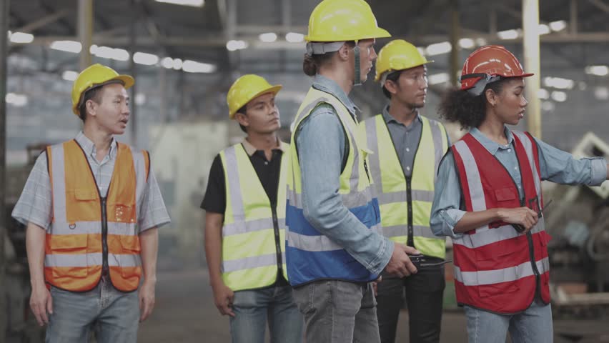 engineers meeting. factory worker people walk and check in warehouse factory. Manager discuss inspection report for internal audit. Quality assurance for manufacturing. Concept Engineer Operating. Royalty-Free Stock Footage #1100635433