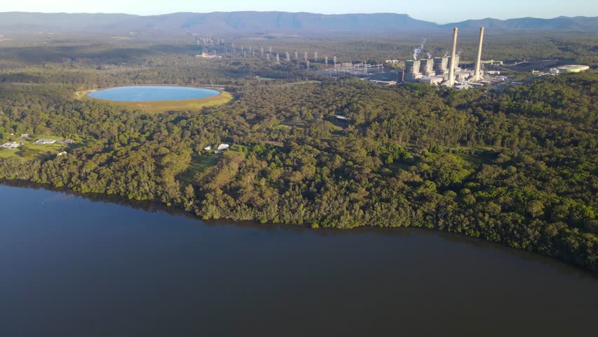 Aerial drone view of Eraring Power Station, Australia’s largest coal fired power station consisting of steam driven turbo alternators located at Eraring, NSW, Australia