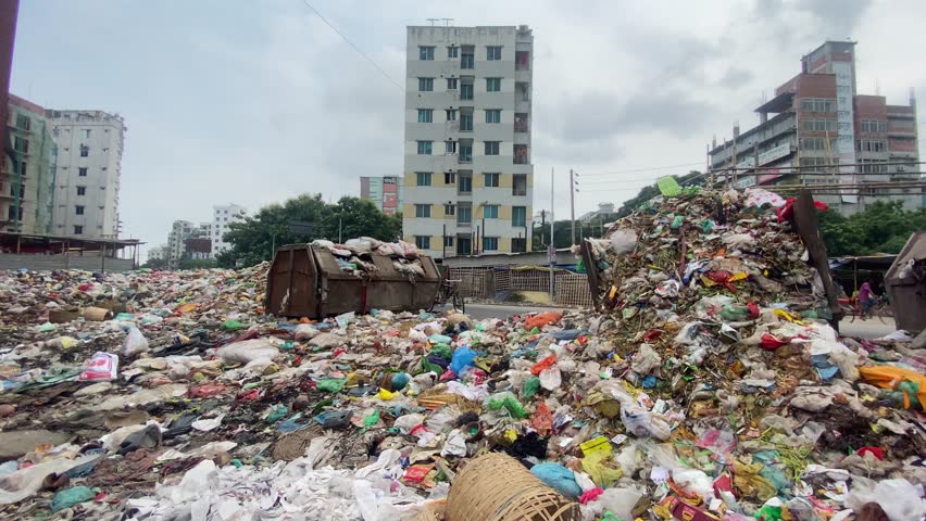 A towering pile of trash and waste, emphasizing the need for proper waste management in third-world countries like the Middle or East Asia. Royalty-Free Stock Footage #1100640947