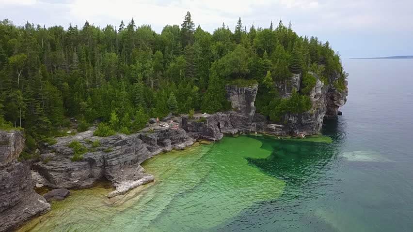 Rugged, clear water shoreline of Georgian Bay at Tobermory in Canada Royalty-Free Stock Footage #1100641557
