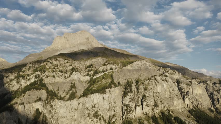 Aerial view Swiss Alps with dramatic clouds