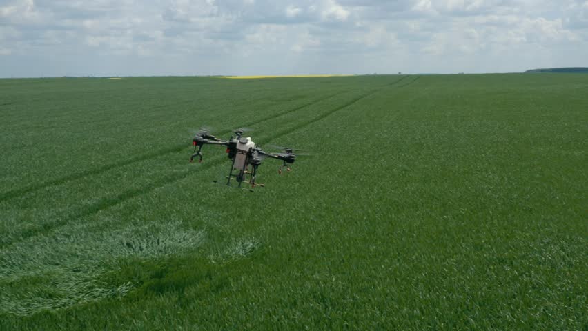 Agriculture drone fly to sprayed fertilizer. agriculture technology. | Shutterstock HD Video #1100643995