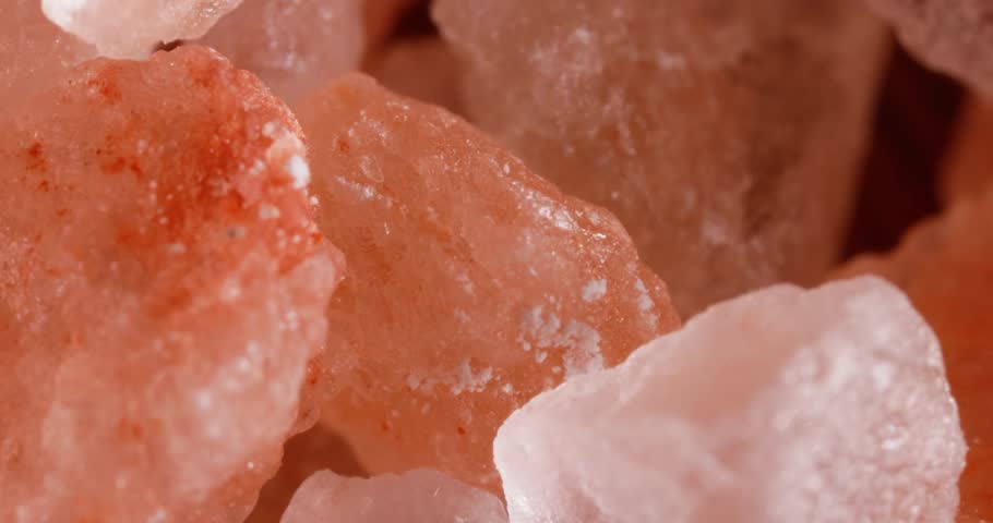 Himalayan pink salt Super Macro Close Up. Due mainly to marketing costs, pink Himalayan salt is up to twenty times more expensive than table or sea salt. Royalty-Free Stock Footage #1100648865