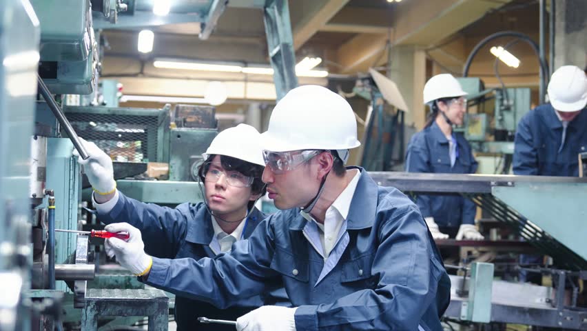 Engineers working in a factory Royalty-Free Stock Footage #1100650233