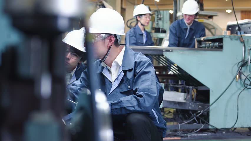 Engineers working in a factory Royalty-Free Stock Footage #1100650265