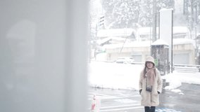 Asian woman in winter coat choosing and buying hot drinks in beverage vending machine during travel small town in Japan in snow day. Attractive girl traveler travel local village on winter vacation. - Powered by Shutterstock - Get 15% off with code: PIKWIZARD15