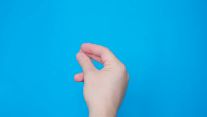 Close up of male hand with clicking fingers on blue screen background. Chromakey | Shutterstock HD Video #1100651455
