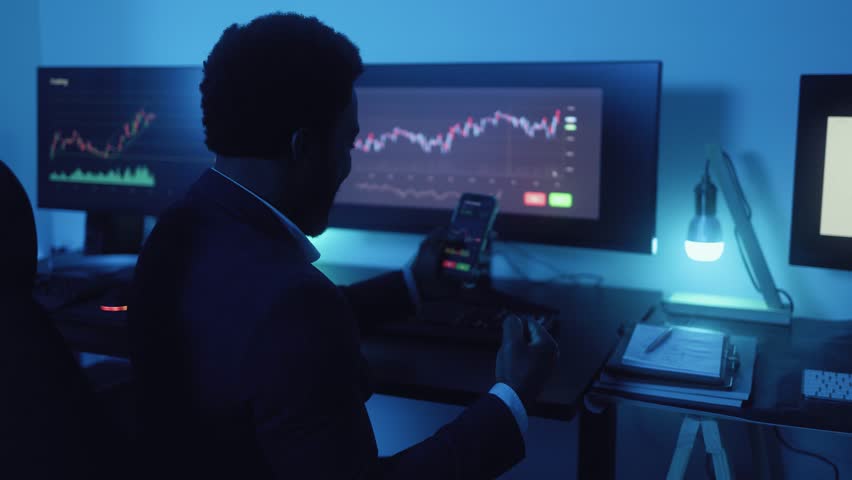 Financial analyst working on stock exchange market in modern office - Fintech concept | Shutterstock HD Video #1100651529