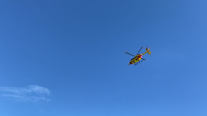 Helicopter flying over a beach near Palavas - France