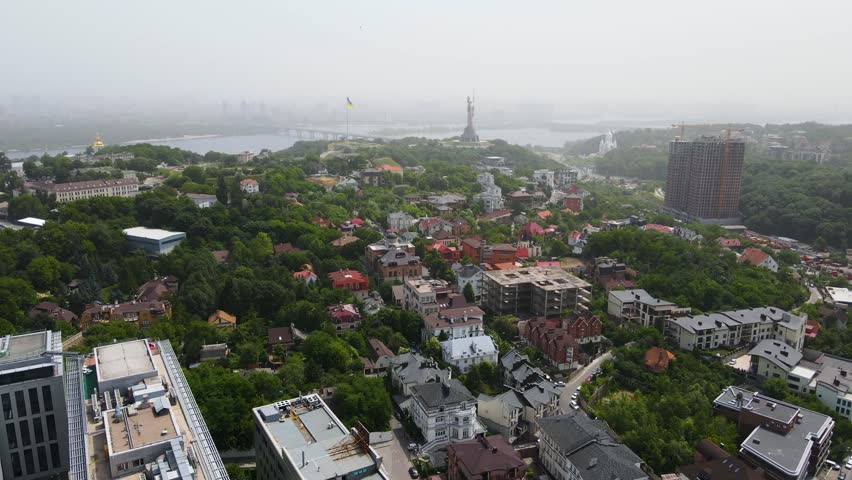 Kyiv capital Ukraine city top view in flight at height panorama of high-rise buildings city center summer
